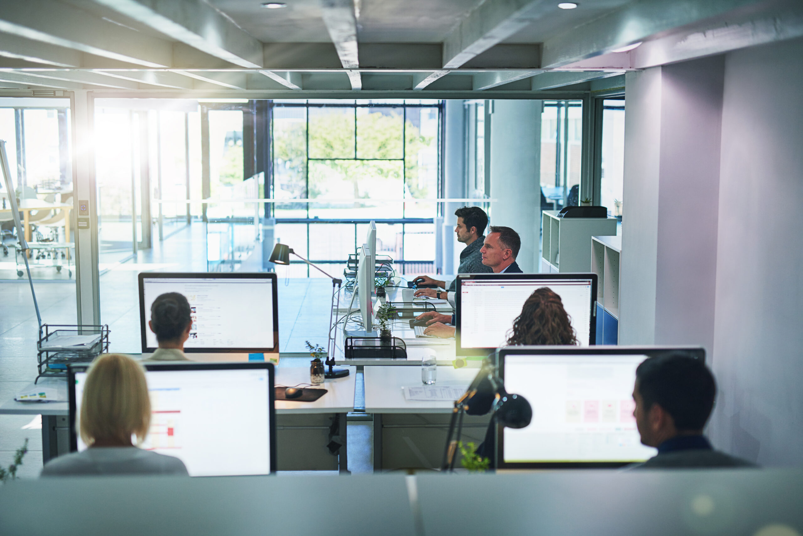 Cropped shot of a group of businesspeople working in the office